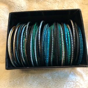 Stack of blue bangle bracelets
